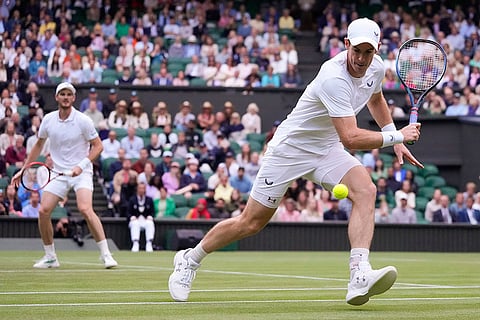 Britain's Andy Murray, right, and brother Jamie Jamie in action